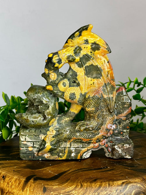 Large hand-carved Eighth Vein crystal dragon with natural druzy pockets and green, gold and orange mineral patterns