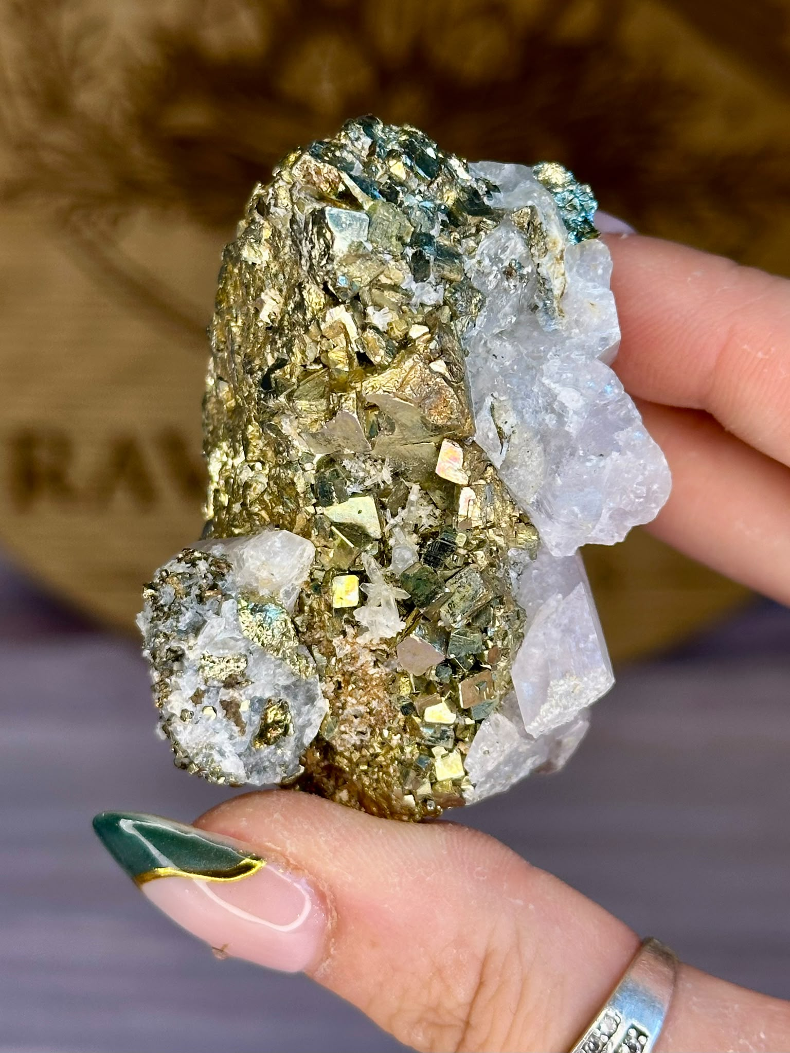 Natural Pyrite with Calcite specimen featuring metallic pyrite cubes and white calcite crystals.