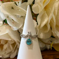 Blue Topaz Ring – Teardrop Halo with Infinity Band