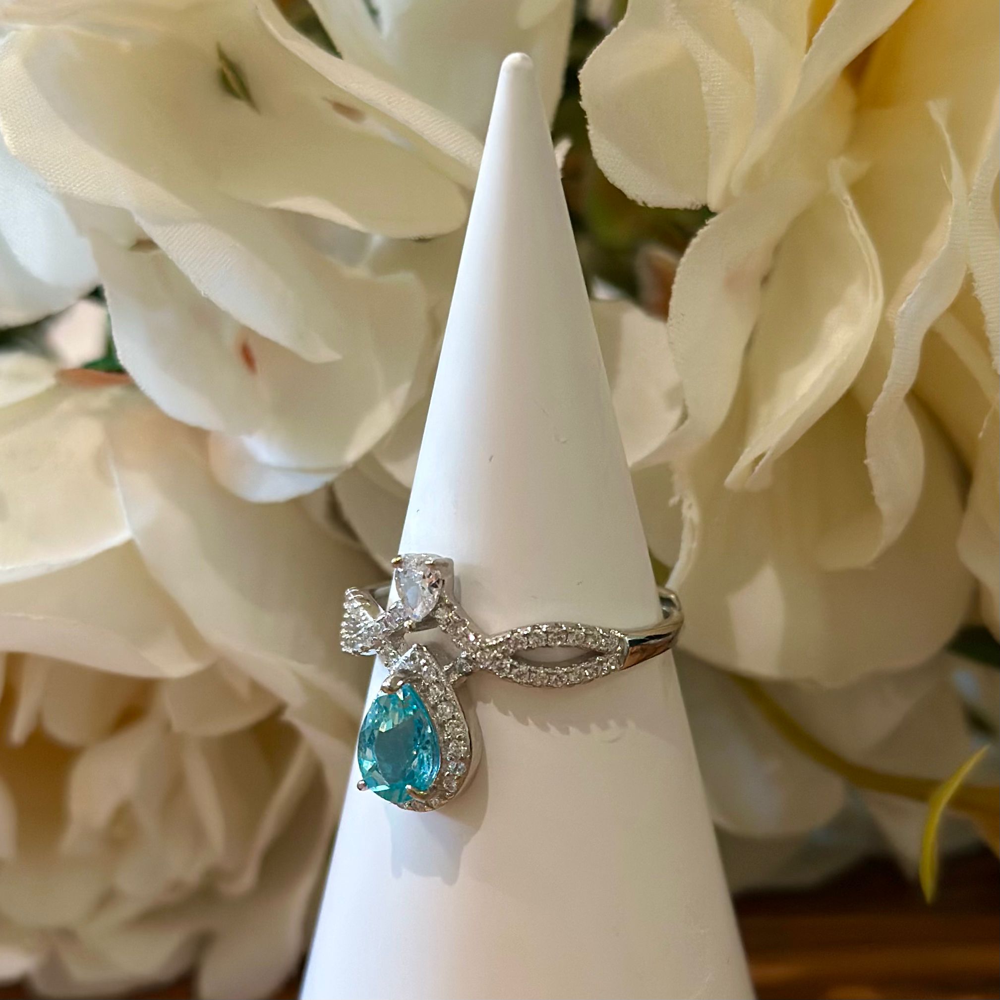 Blue Topaz Ring – Teardrop Halo with Infinity Band