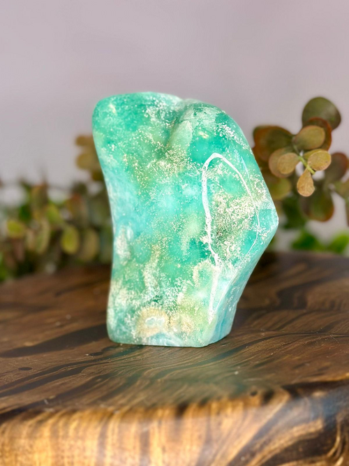 Side view of polished Blue Aragonite freeform showing aqua blue natural formations
