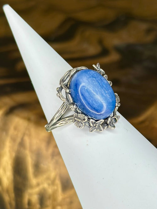 Side view of Blue Kyanite ring with flower and butterfly setting