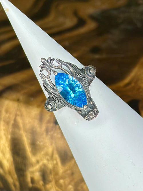 Blue Topaz dragon statement ring with vivid faceted gemstone