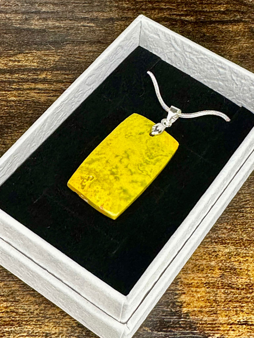 Polished Bumblebee Jasper rectangular pendant featuring vibrant yellow colouring and natural darker mineral patterning