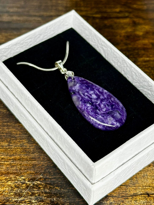 Polished Charoite teardrop pendant featuring rich purple, violet and lavender natural swirling patterns