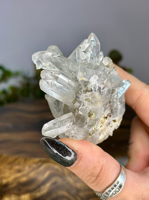 Side view of Chlorite Quartz cluster showing layered clear points and natural mineral inclusions.