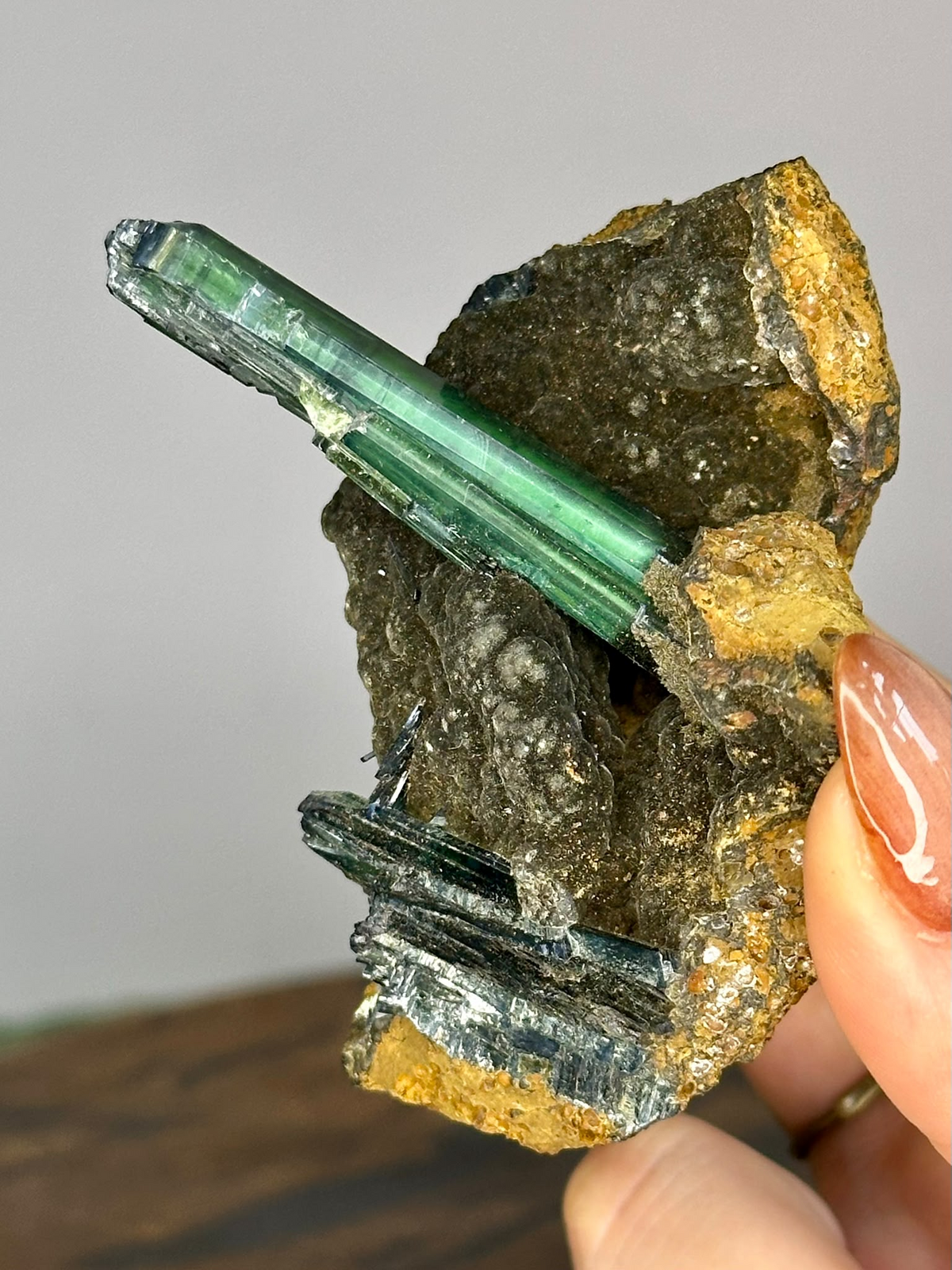 Collector Vivianite specimen with long translucent green crystal on natural matrix