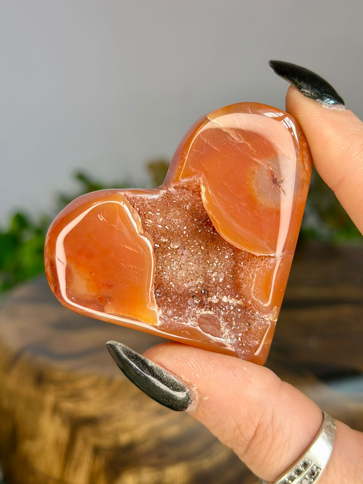 Polished orange Druzy Carnelian heart with large sparkling natural crystal cave and translucent agate banding