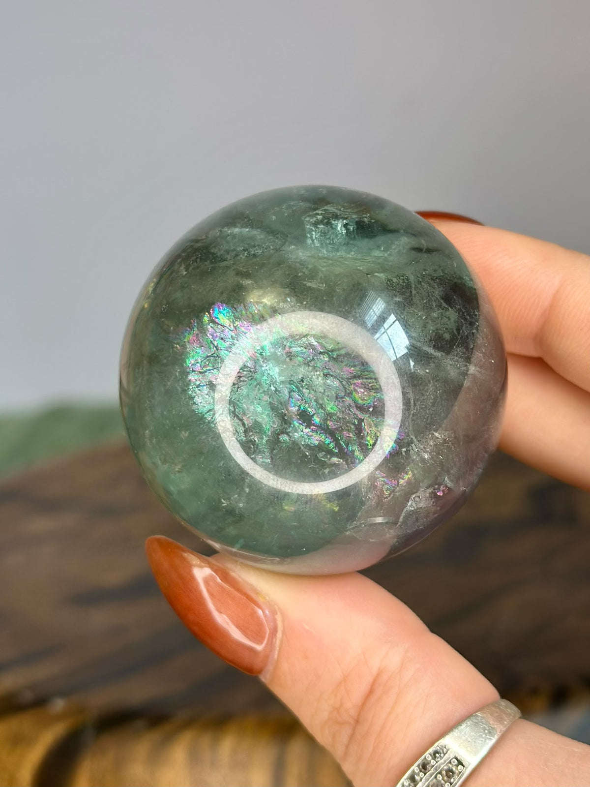 Green Fluorite sphere 186g with vivid natural pink green and purple rainbow flashes