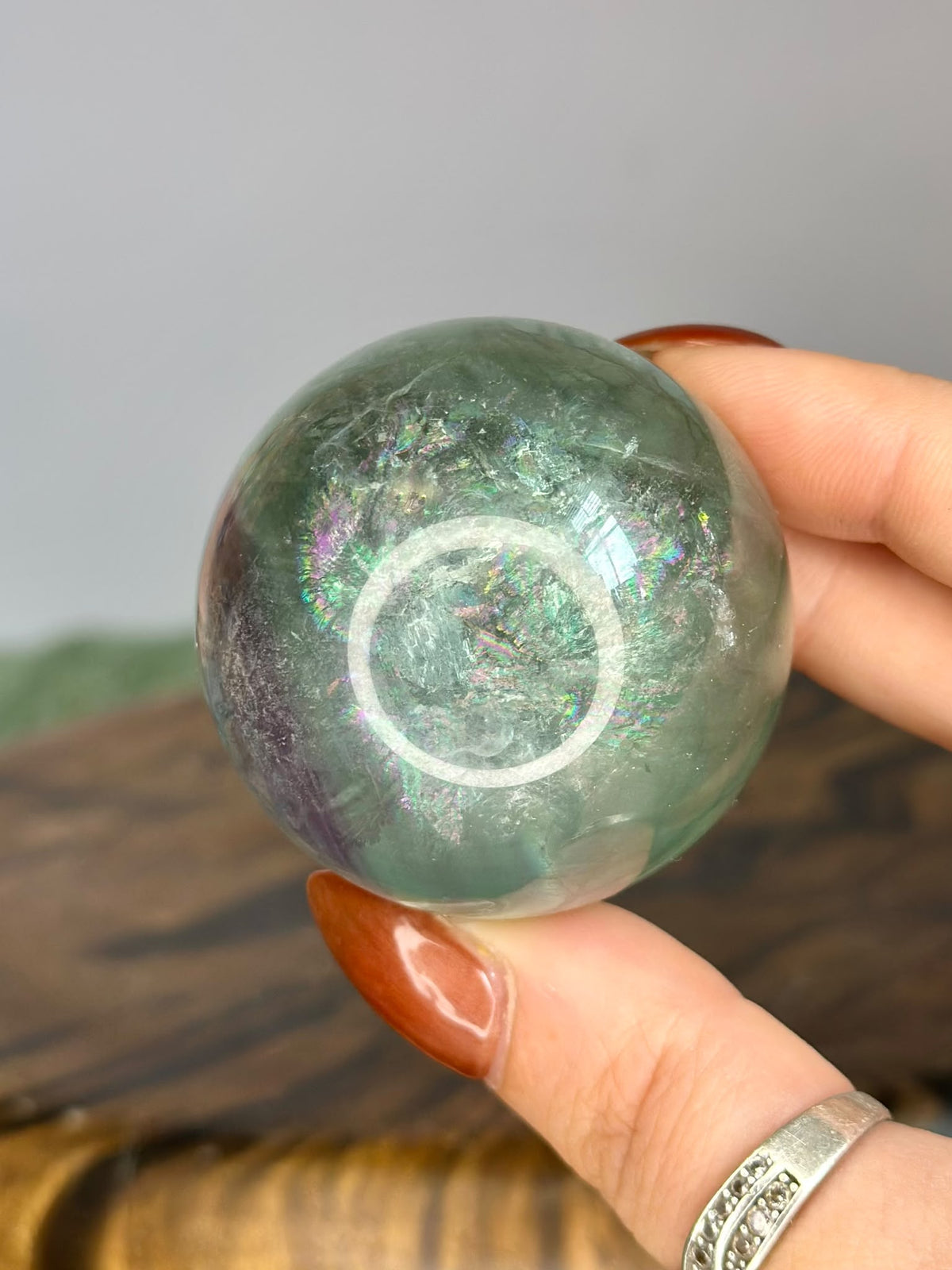 Green Fluorite 5cm sphere with natural internal veils and iridescent rainbow flashes