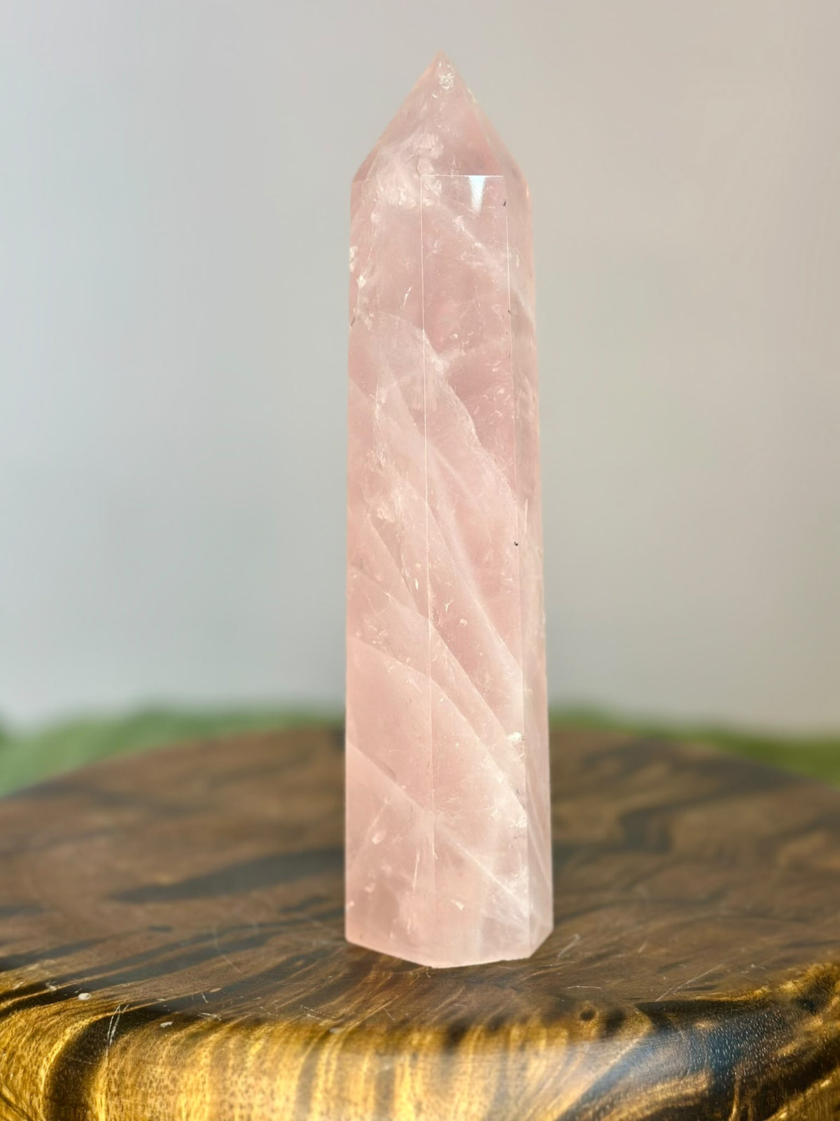 Reverse view of large polished Brazilian Rose Quartz tower with natural internal veiling