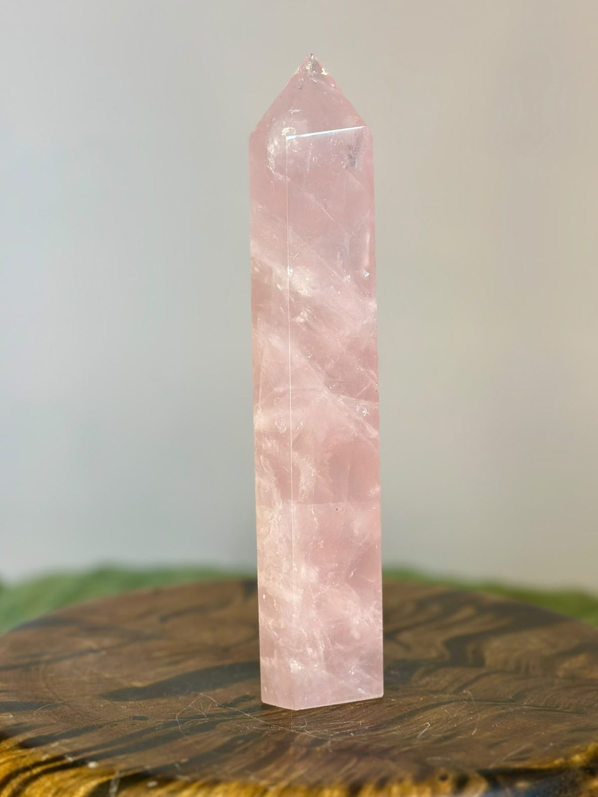 Reverse view of 20cm polished Brazilian Rose Quartz tower with natural internal inclusions