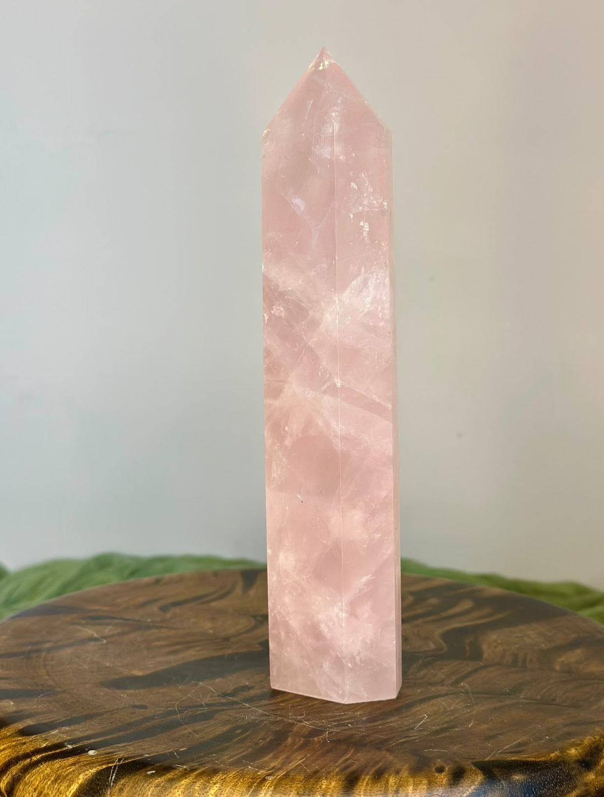 Side view of large Brazilian Rose Quartz tower showing soft pink colour and natural veiling