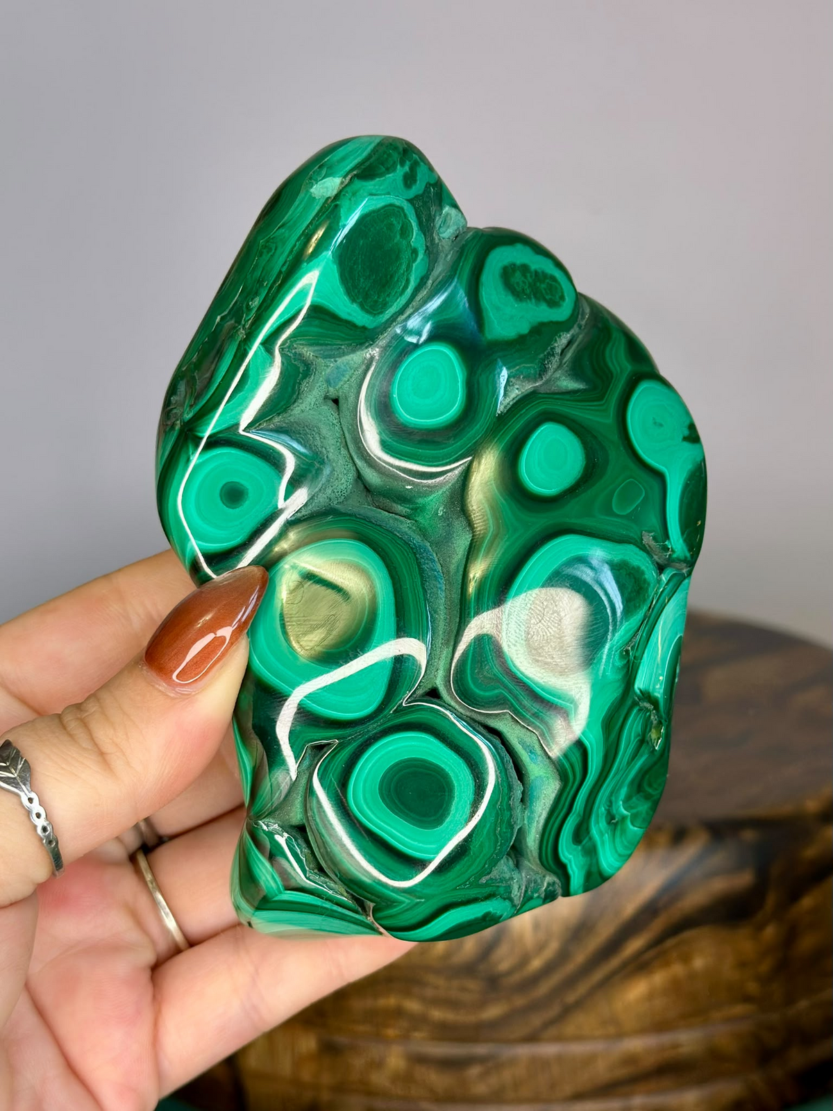 Polished Malachite crystal showing concentric green bullseye and banded patterns