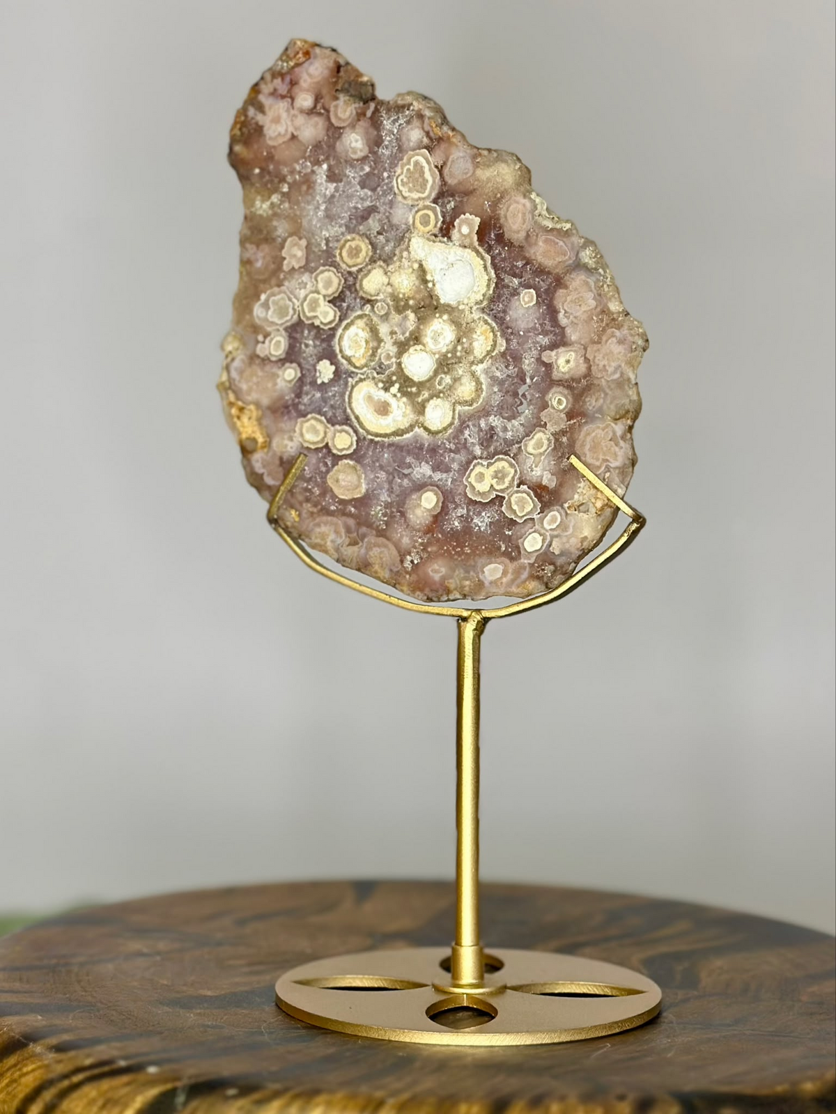 Reverse side of large natural Pink Amethyst specimen on gold metal stand