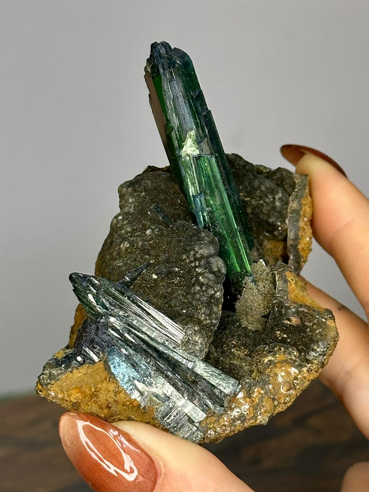 Vivianite mineral specimen showing green bladed crystals and natural matrix